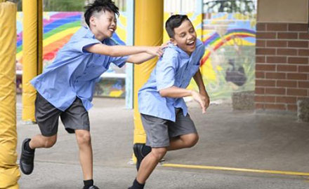 Two boys playing at school