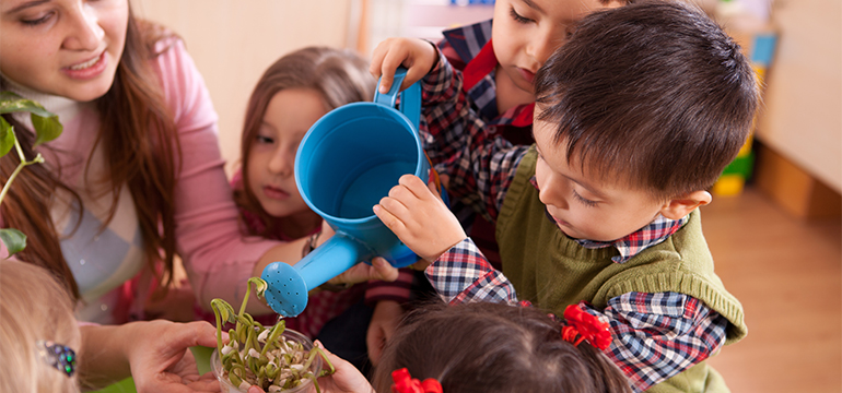 Kids learning to care for plant