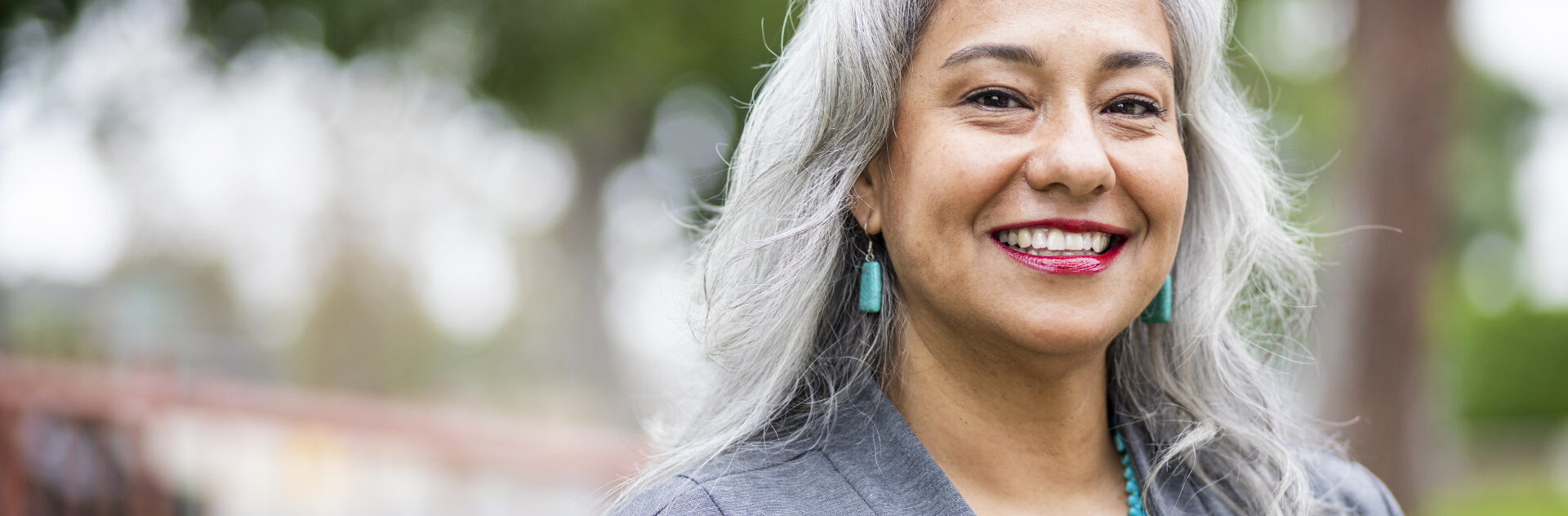 A portrait of a senior mexican female administrator on a campus